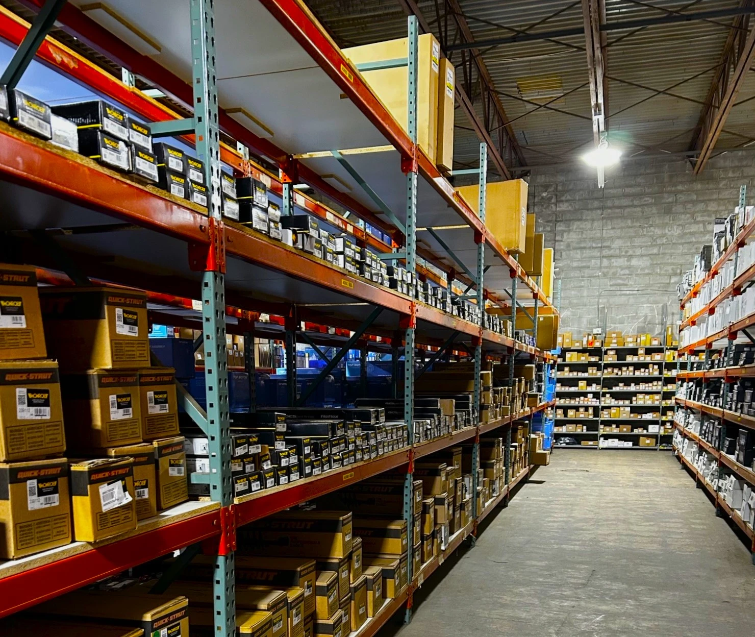 Rows of racks containing auto parts and auto related product that are stocked in United Auto Supply in Buffalo.