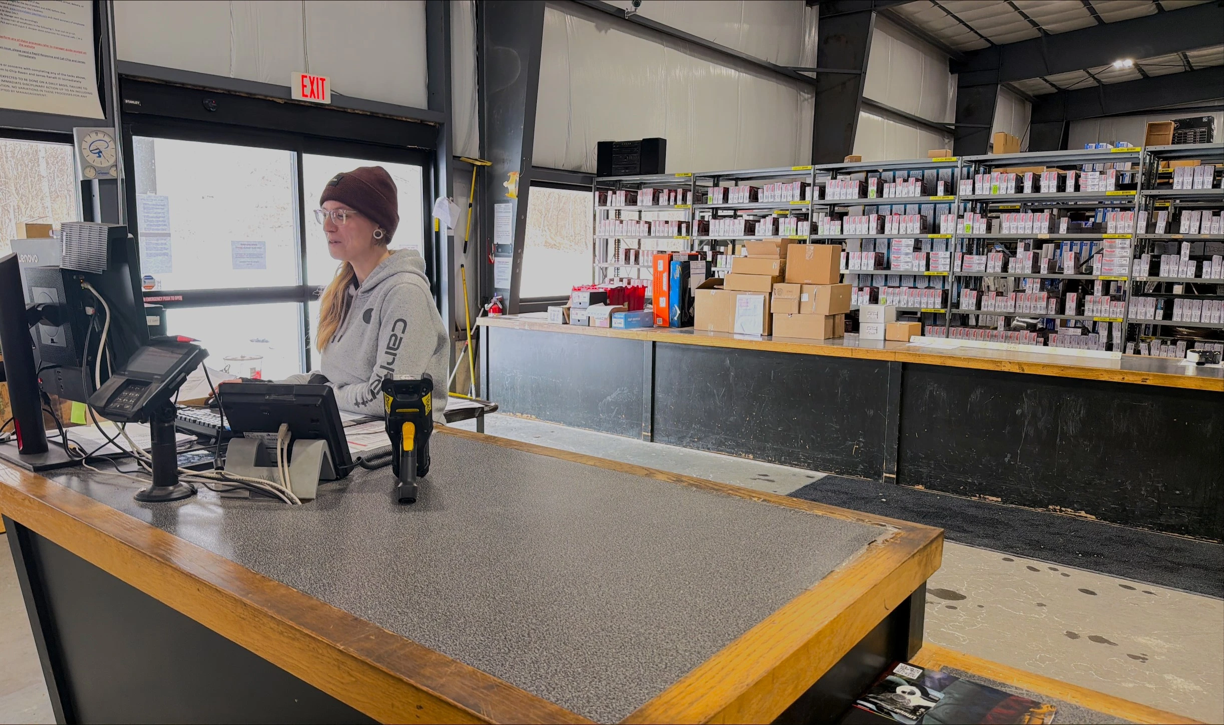 Happy United Auto Supply employee working behind the counter.